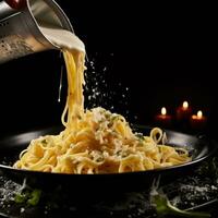 AI generated fettuccine with parmesan cheese being poured onto black counter photo