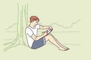 Man draws in electronic tablet sitting on shore of lake and enjoying beautiful landscape of morning nature. Creative young man is experiencing surge of inspiration being in park with river vector