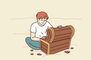 Treasure hunter boy found wooden chest with gold and is sitting on beach looking at prey. Little kid dreams of finding sunken treasure of pirates from middle ages and getting rich. vector