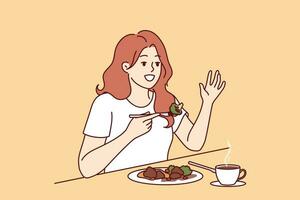 Woman is having lunch in cafe sitting at table and raising hand up to call waiter. Cafe visitor girl eats steamed vegetables to avoid passing fatty and caloric food causing weight gain vector