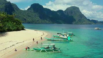 Typical Filipino boats on a tropicalisland on helicopter island video