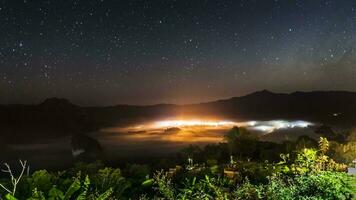 cloudy foggy landscape view above of mountain at sunrise timing video