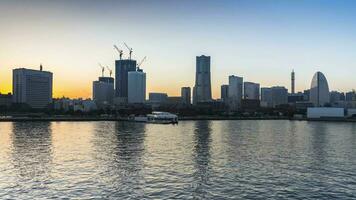 night cityscape view reflect on water againts sky video