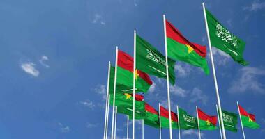 Burkina Faso and KSA, Kingdom of Saudi Arabia Flags Waving Together in the Sky, Seamless Loop in Wind, Space on Left Side for Design or Information, 3D Rendering video