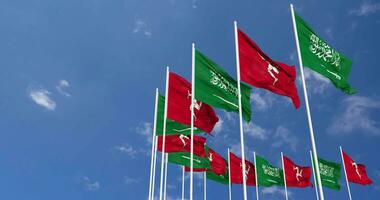 Isle of Man and KSA, Kingdom of Saudi Arabia Flags Waving Together in the Sky, Seamless Loop in Wind, Space on Left Side for Design or Information, 3D Rendering video