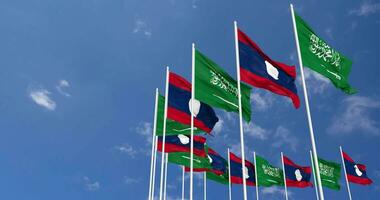 Laos and KSA, Kingdom of Saudi Arabia Flags Waving Together in the Sky, Seamless Loop in Wind, Space on Left Side for Design or Information, 3D Rendering video