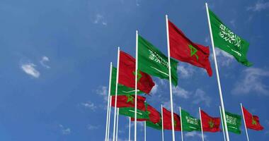 Morocco and KSA, Kingdom of Saudi Arabia Flags Waving Together in the Sky, Seamless Loop in Wind, Space on Left Side for Design or Information, 3D Rendering video