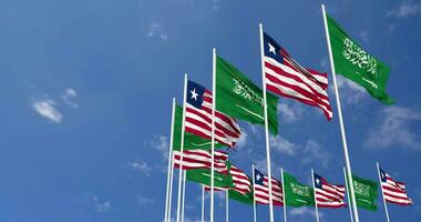 Liberia and KSA, Kingdom of Saudi Arabia Flags Waving Together in the Sky, Seamless Loop in Wind, Space on Left Side for Design or Information, 3D Rendering video