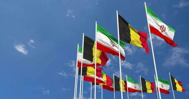 Belgium and Iran Flags Waving Together in the Sky, Seamless Loop in Wind, Space on Left Side for Design or Information, 3D Rendering video