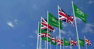 United Kingdom and KSA, Kingdom of Saudi Arabia Flags Waving Together in the Sky, Seamless Loop in Wind, Space on Left Side for Design or Information, 3D Rendering video