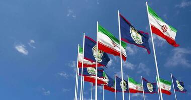 Belize and Iran Flags Waving Together in the Sky, Seamless Loop in Wind, Space on Left Side for Design or Information, 3D Rendering video