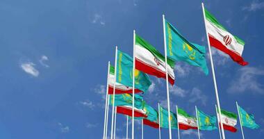 Kazakhstan and Iran Flags Waving Together in the Sky, Seamless Loop in Wind, Space on Left Side for Design or Information, 3D Rendering video