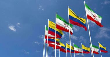 Colombia and Iran Flags Waving Together in the Sky, Seamless Loop in Wind, Space on Left Side for Design or Information, 3D Rendering video