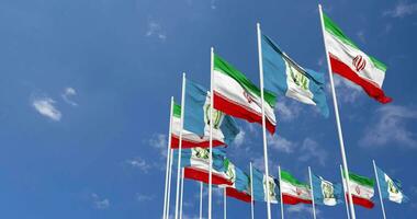 Guatemala and Iran Flags Waving Together in the Sky, Seamless Loop in Wind, Space on Left Side for Design or Information, 3D Rendering video