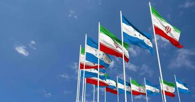 Honduras and Iran Flags Waving Together in the Sky, Seamless Loop in Wind, Space on Left Side for Design or Information, 3D Rendering video