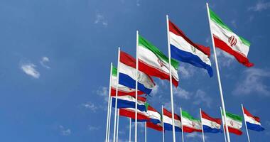 Paraguay and Iran Flags Waving Together in the Sky, Seamless Loop in Wind, Space on Left Side for Design or Information, 3D Rendering video