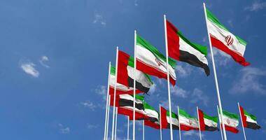 United Arab Emirates and Iran Flags Waving Together in the Sky, Seamless Loop in Wind, Space on Left Side for Design or Information, 3D Rendering video