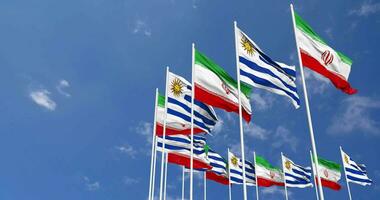 Uruguay and Iran Flags Waving Together in the Sky, Seamless Loop in Wind, Space on Left Side for Design or Information, 3D Rendering video