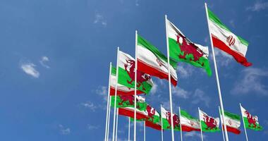 Wales and Iran Flags Waving Together in the Sky, Seamless Loop in Wind, Space on Left Side for Design or Information, 3D Rendering video