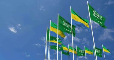 Gabon and KSA, Kingdom of Saudi Arabia Flags Waving Together in the Sky, Seamless Loop in Wind, Space on Left Side for Design or Information, 3D Rendering video