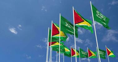 Guyana e ksa, regno di Arabia arabia bandiere agitando insieme nel il cielo, senza soluzione di continuità ciclo continuo nel vento, spazio su sinistra lato per design o informazione, 3d interpretazione video