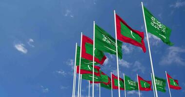 Maldives and KSA, Kingdom of Saudi Arabia Flags Waving Together in the Sky, Seamless Loop in Wind, Space on Left Side for Design or Information, 3D Rendering video