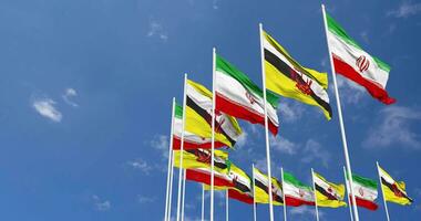 Brunei and Iran Flags Waving Together in the Sky, Seamless Loop in Wind, Space on Left Side for Design or Information, 3D Rendering video