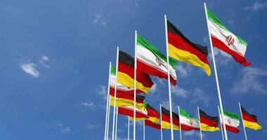Germany and Iran Flags Waving Together in the Sky, Seamless Loop in Wind, Space on Left Side for Design or Information, 3D Rendering video