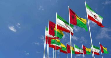 Guinea Bissau and Iran Flags Waving Together in the Sky, Seamless Loop in Wind, Space on Left Side for Design or Information, 3D Rendering video