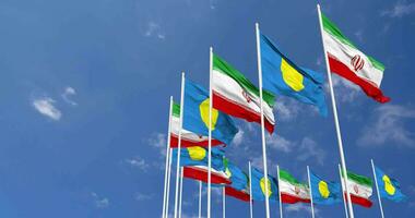 Palau and Iran Flags Waving Together in the Sky, Seamless Loop in Wind, Space on Left Side for Design or Information, 3D Rendering video