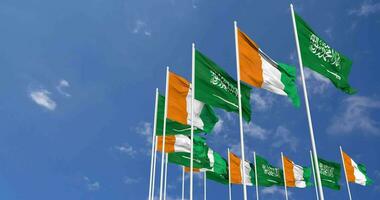 Ivory Coast and KSA, Kingdom of Saudi Arabia Flags Waving Together in the Sky, Seamless Loop in Wind, Space on Left Side for Design or Information, 3D Rendering video