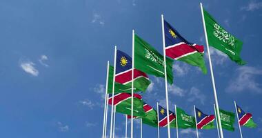 Namibia and KSA, Kingdom of Saudi Arabia Flags Waving Together in the Sky, Seamless Loop in Wind, Space on Left Side for Design or Information, 3D Rendering video