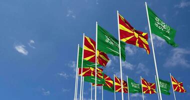 North Macedonia and KSA, Kingdom of Saudi Arabia Flags Waving Together in the Sky, Seamless Loop in Wind, Space on Left Side for Design or Information, 3D Rendering video
