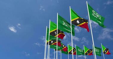 Saint Kitts and Nevis and KSA, Kingdom of Saudi Arabia Flags Waving Together in the Sky, Seamless Loop in Wind, Space on Left Side for Design or Information, 3D Rendering video