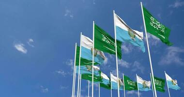 San Marino and KSA, Kingdom of Saudi Arabia Flags Waving Together in the Sky, Seamless Loop in Wind, Space on Left Side for Design or Information, 3D Rendering video