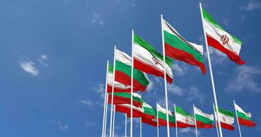 Bulgaria and Iran Flags Waving Together in the Sky, Seamless Loop in Wind, Space on Left Side for Design or Information, 3D Rendering video