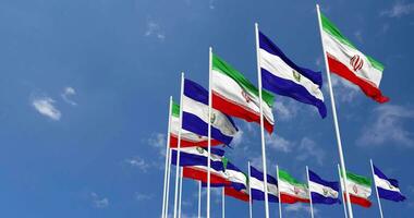 El Salvador and Iran Flags Waving Together in the Sky, Seamless Loop in Wind, Space on Left Side for Design or Information, 3D Rendering video