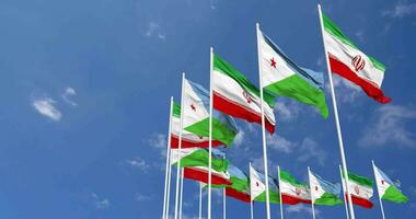 Djibouti and Iran Flags Waving Together in the Sky, Seamless Loop in Wind, Space on Left Side for Design or Information, 3D Rendering video