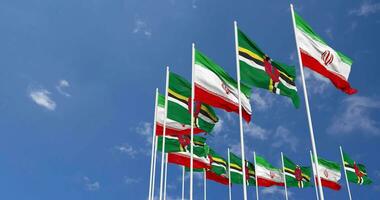 Dominica and Iran Flags Waving Together in the Sky, Seamless Loop in Wind, Space on Left Side for Design or Information, 3D Rendering video