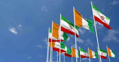 Ivory Coast and Iran Flags Waving Together in the Sky, Seamless Loop in Wind, Space on Left Side for Design or Information, 3D Rendering video