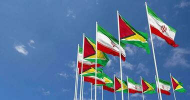 Guyana and Iran Flags Waving Together in the Sky, Seamless Loop in Wind, Space on Left Side for Design or Information, 3D Rendering video