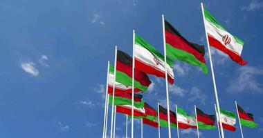 Malawi and Iran Flags Waving Together in the Sky, Seamless Loop in Wind, Space on Left Side for Design or Information, 3D Rendering video