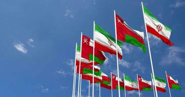 Oman and Iran Flags Waving Together in the Sky, Seamless Loop in Wind, Space on Left Side for Design or Information, 3D Rendering video