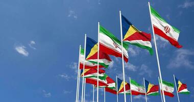 Seychelles and Iran Flags Waving Together in the Sky, Seamless Loop in Wind, Space on Left Side for Design or Information, 3D Rendering video