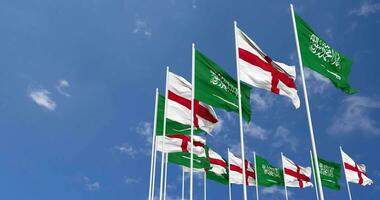 England and KSA, Kingdom of Saudi Arabia Flags Waving Together in the Sky, Seamless Loop in Wind, Space on Left Side for Design or Information, 3D Rendering video
