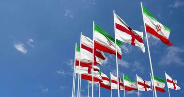 England and Iran Flags Waving Together in the Sky, Seamless Loop in Wind, Space on Left Side for Design or Information, 3D Rendering video