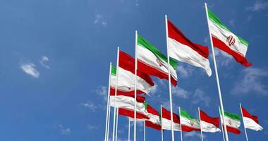 Indonesia and Iran Flags Waving Together in the Sky, Seamless Loop in Wind, Space on Left Side for Design or Information, 3D Rendering video