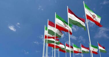 Hungary and Iran Flags Waving Together in the Sky, Seamless Loop in Wind, Space on Left Side for Design or Information, 3D Rendering video