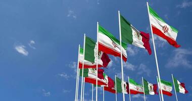 Mexico and Iran Flags Waving Together in the Sky, Seamless Loop in Wind, Space on Left Side for Design or Information, 3D Rendering video