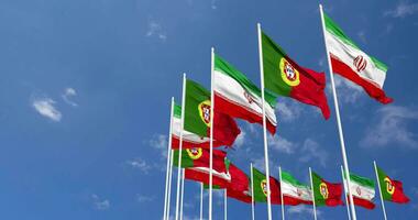 Portugal and Iran Flags Waving Together in the Sky, Seamless Loop in Wind, Space on Left Side for Design or Information, 3D Rendering video